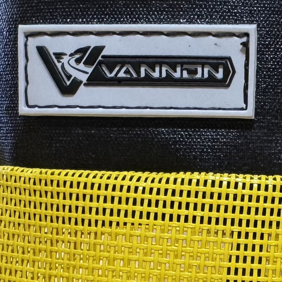 VANNON logo on a black and yellow textured surface