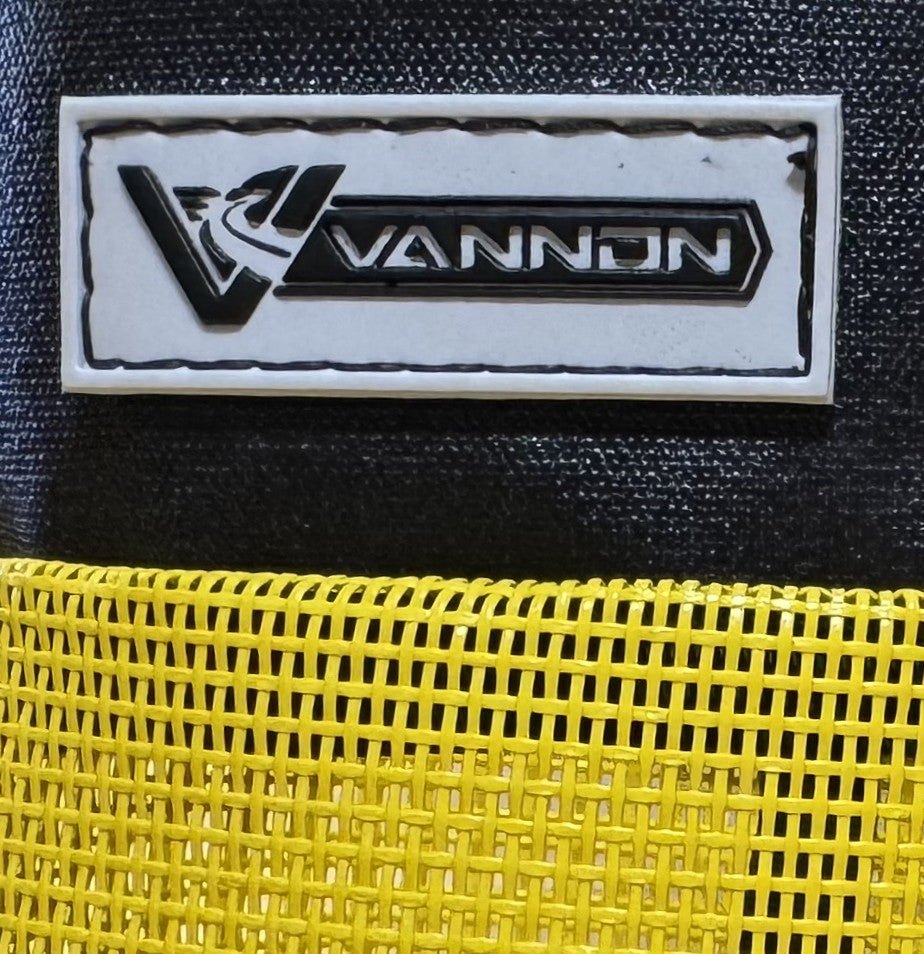 VANNON logo on a black and yellow textured surface